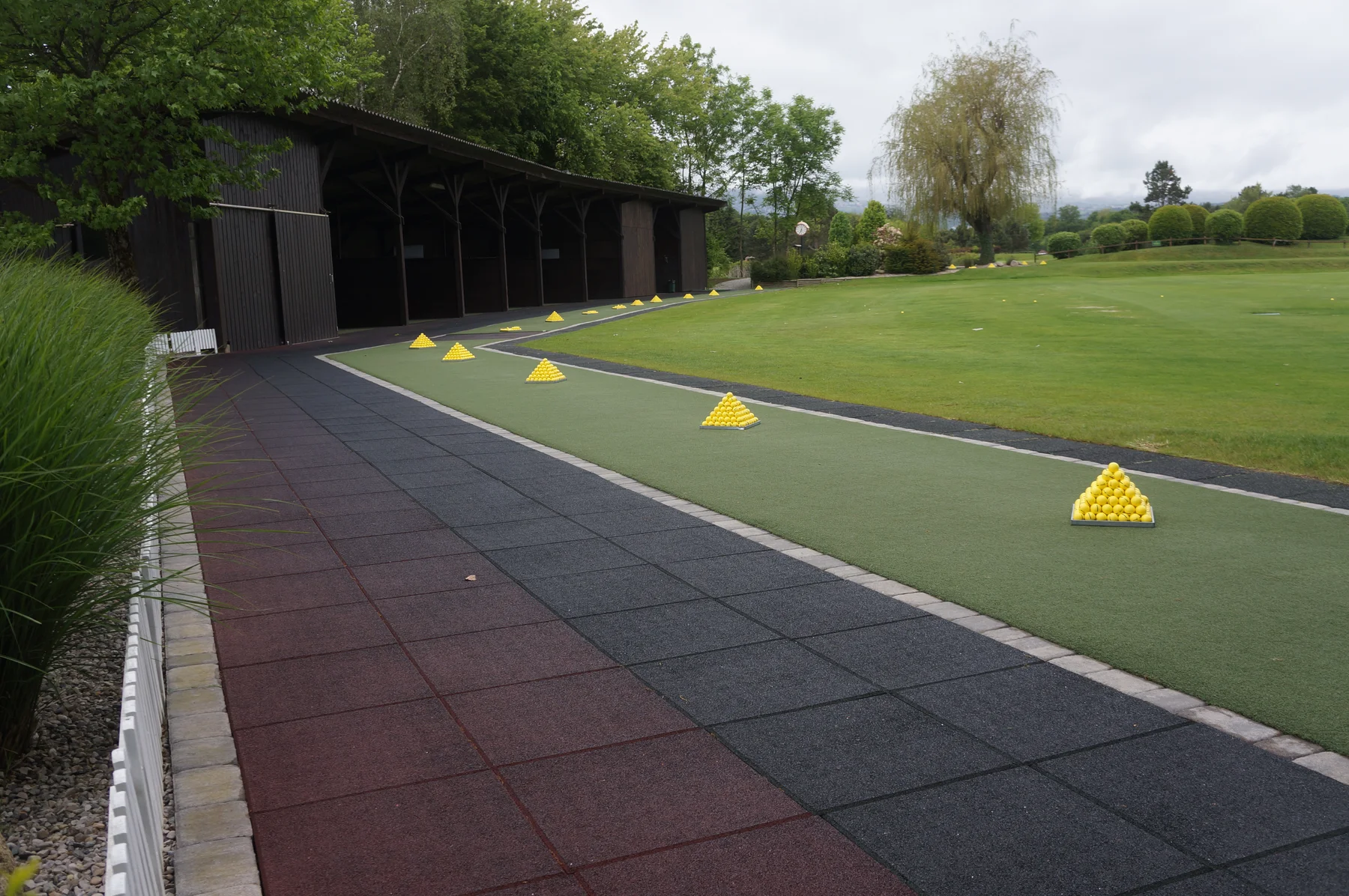 Artificial turf tee line with ball pyramids